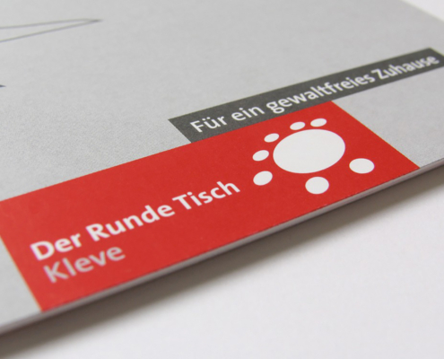 Logo Der Runde Tisch Kleve – Für ein gewaltfreies Zuhause. Kommunikationsdesign Lutz Kamieth